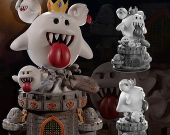 May include: A white cartoon ghost figure with a red tongue, wearing a gold crown, and surrounded by smaller ghosts. The figure is perched atop a grey castle-like structure with a green door. The design is reminiscent of a video game character.