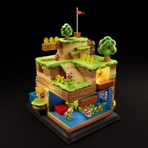 Puede incluir: Un diorama 3D de un nivel de Super Mario Bros., con un paisaje verde y marrón con una bandera roja, una estrella amarilla, un hongo rojo y una tubería verde. El diorama también incluye una pequeña figura de Mario, un Goomba y una planta Piraña.