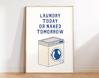 Op de afbeelding: Een wit ingelijst print met een blauwe illustratie van een wasmachine en de tekst "Laundry Today or Naked Tomorrow."