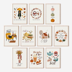 Può includere: Set di 9 illustrazioni autunnali stampabili con vari disegni autunnali, tra cui zucche, foglie, un cottage accogliente, un gatto su una sedia, una teiera e una tazza di caffè. Le illustrazioni sono in una tavolozza di colori caldi di arancione, marrone, giallo e verde.