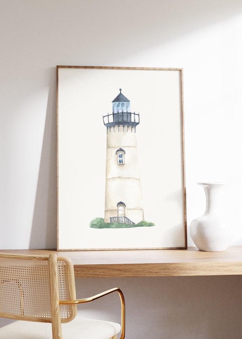 May include: A watercolor painting of a white lighthouse with a black roof and a blue window. The lighthouse is on a green grassy hill.