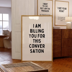 May include: Three framed prints with white backgrounds and black text. The top left print reads "I want to cry, but I am the manager so plan of action." The top right print reads "I see your point." The bottom print reads "I am billing you for this conversation."