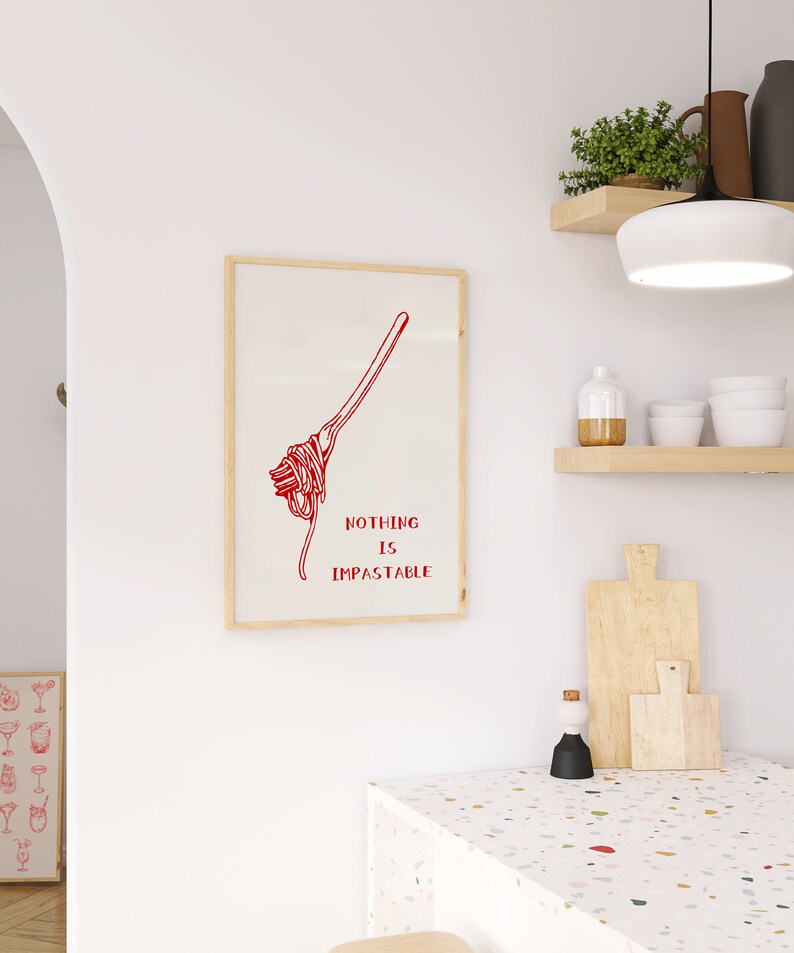 May include: A framed print with a red illustration of spaghetti and the text "Nothing is Impassable".