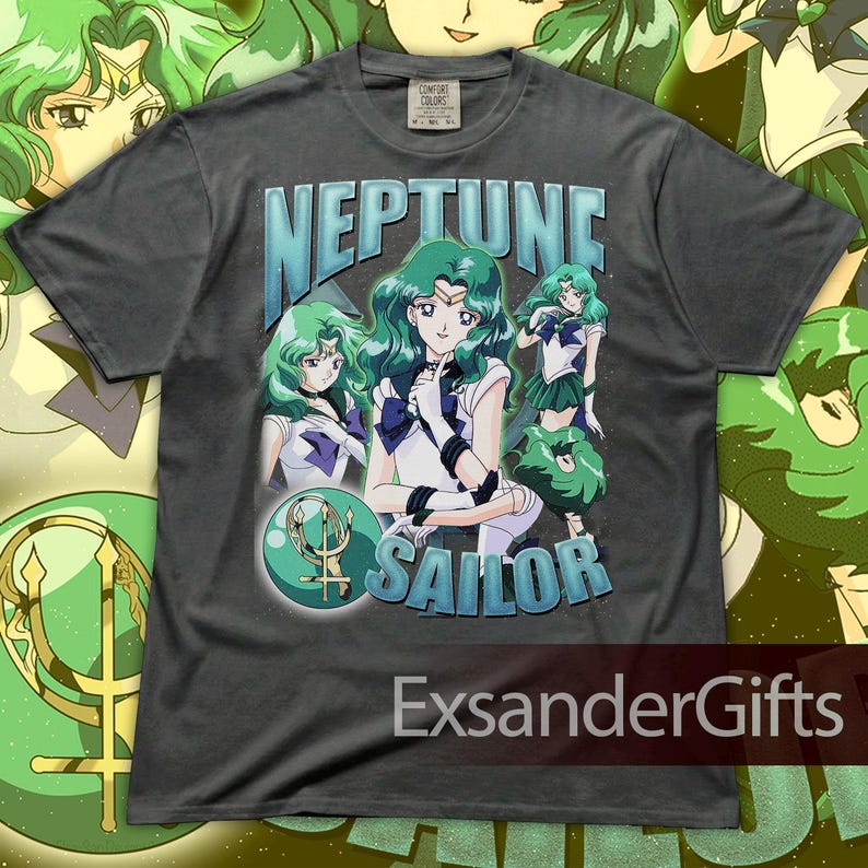 May include: Dark gray t-shirt featuring a graphic of Sailor Neptune with green hair and a blue and white outfit. The text "NEPTUNE SAILOR" is displayed in blue and white. The shirt has a vintage style.