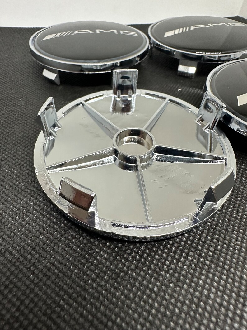thumbnail interactive-video image 1 of 4x Mercedes-Benz 68mm Black Wheel Center Caps – AMG Style, 65mm Inner Diameter, OEM A1710000000 1 of 2