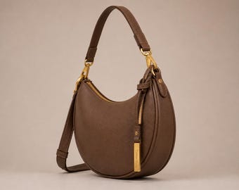 Handgemaakte schoudertas in halvemaanvorm van generfd leer, bruine hobo-tas, goudkleurige hardware