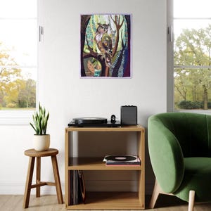 Textile owl artwork displayed as woodland-inspired wall decor in a cozy living room or study.
