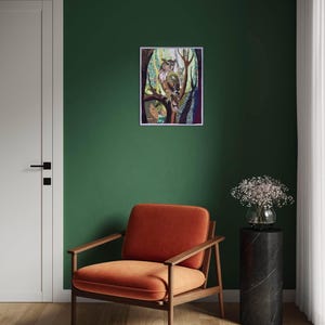 Textile owl artwork displayed as woodland-inspired wall decor in a cozy living room or study.