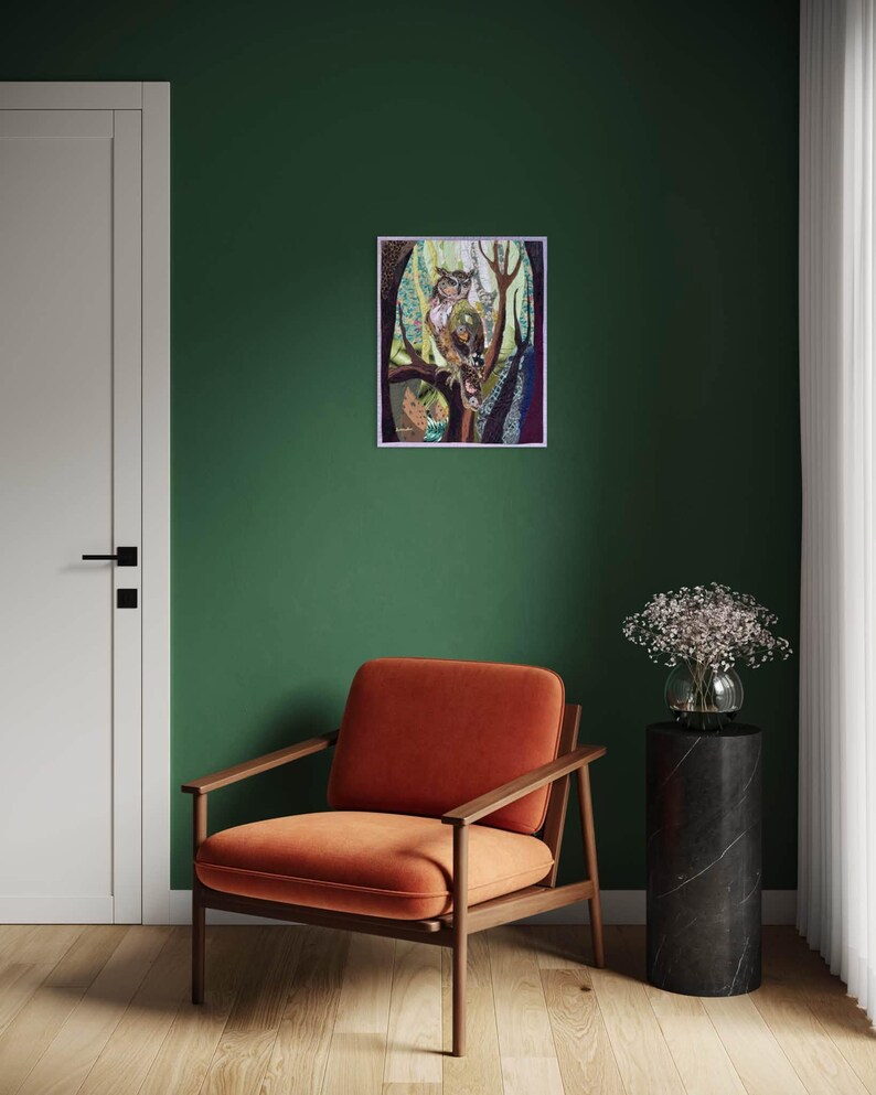 Textile owl artwork displayed as woodland-inspired wall decor in a cozy living room or study.