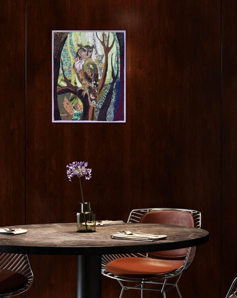 Textile owl artwork displayed as woodland-inspired wall decor in a cozy living room or study.