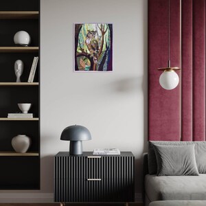 Textile owl artwork displayed as woodland-inspired wall decor in a cozy living room or study.