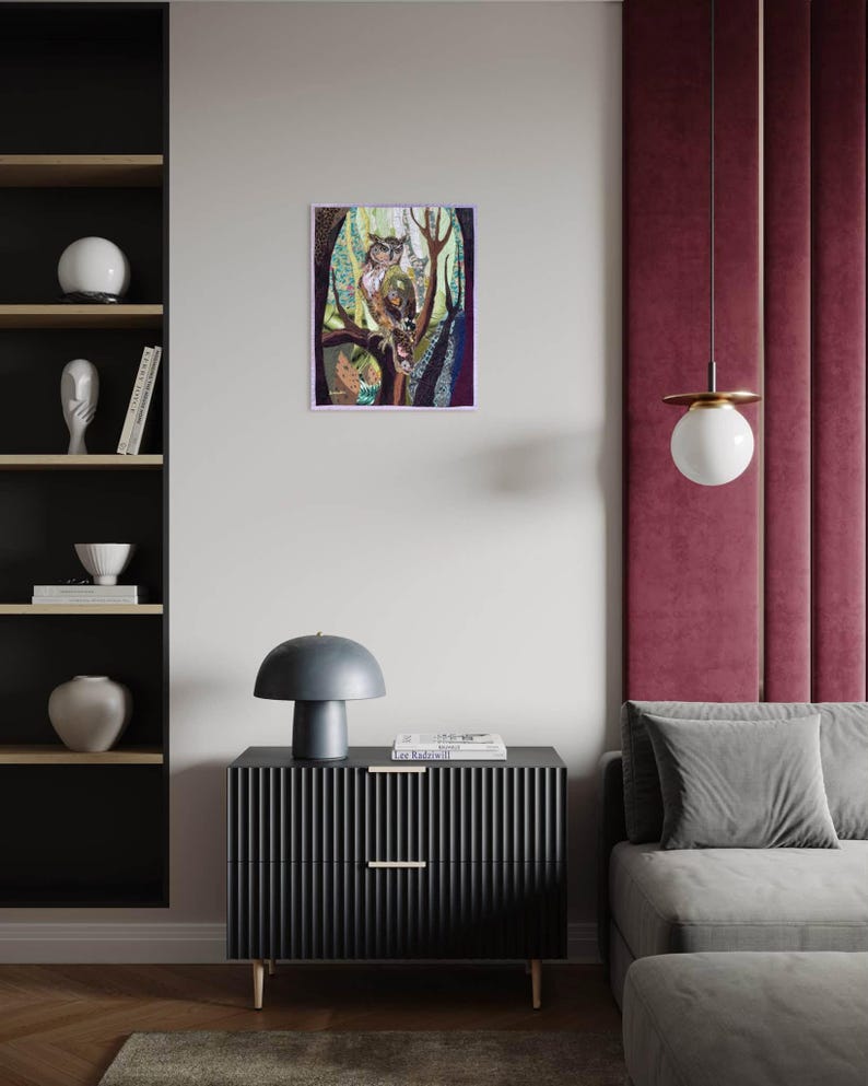 Textile owl artwork displayed as woodland-inspired wall decor in a cozy living room or study.