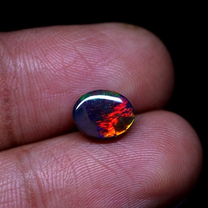 AAAAA Grade Natural Black Opal Cabochon Gemstone+Welo Fire Black Opal+ Handmade oval Shape Opal+October Birthstone Gemstone, Size 9x7 MM.