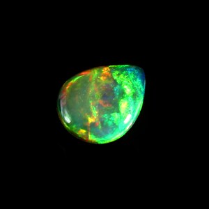May include: A polished, teardrop-shaped opal gemstone. The opal displays a vibrant play of color, with flashes of green, yellow, orange, and blue. The gemstone is set against a black background, highlighting its iridescent qualities.