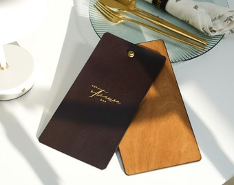 May include: Two wooden menu boards, one dark brown and one light brown, with gold lettering that reads "The Extension Bar".
