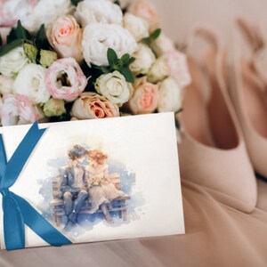 Wedding card mockup with watercolor lovers, wrapped with blue ribbon beside bridal shoes.