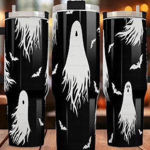 May include: Three black and white stainless steel tumblers with a ghost and bat design. The tumblers have a black handle and a straw lid.