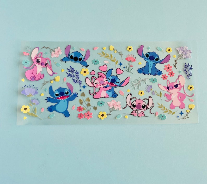 May include: A sheet of colorful stickers featuring various cartoon characters from the Disney movie Lilo & Stitch. The stickers feature Stitch and Angel in various poses, including hugging, smiling, and waving. The stickers are surrounded by flowers and other decorative elements.