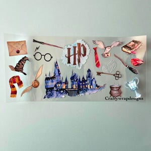 May include: A sheet of stickers featuring various elements from a fantasy series. Includes a castle, glasses, a wand, a scarf, a golden snitch, an owl, a book, and other themed items. The text "HP" is also present.