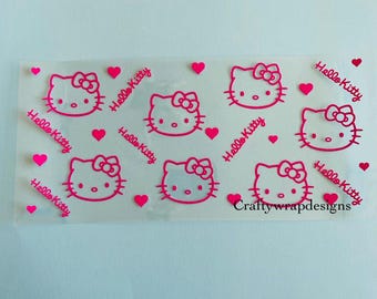 May include: A clear sheet featuring a repeating pattern of pink Hello Kitty faces, bows, and hearts. The words "Hello Kitty" are written in pink script. The text "Craftywrapdesigns" is also visible.