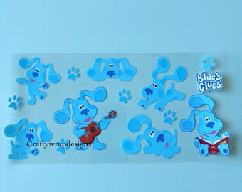 Könnte beinhalten: Ein Bogen mit Aufklebern mit der Figur Blue aus Blue's Clues. Die Aufkleber sind hellblau und enthalten Bilder von Blue in verschiedenen Posen, Pfotenabdrücke und das Logo der Show. Der Text "Craftywrapdesigns" ist ebenfalls vorhanden.
