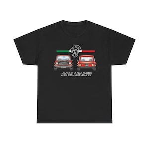 May include: Black t-shirt featuring a white graphic of a red Fiat A112 Abarth car with the Italian flag and the scorpion logo. The text "A112 ABARTH" is printed below the car.
