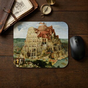 May include: A rectangular mouse pad featuring a reproduction of Pieter Bruegel the Elder's painting of the Tower of Babel, depicting a massive, multi-tiered stone structure under construction with numerous small figures in a landscape setting.