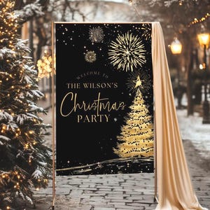 May include: A black Christmas party sign with gold text and accents. The sign reads "Welcome to The Wilson's Christmas Party" with a gold Christmas tree and fireworks design. The sign is displayed on a gold metal stand with a cream-colored drape.
