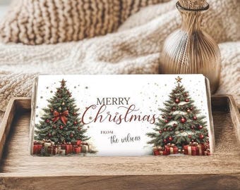 May include: A rectangular Christmas-themed gift tag with the words "MERRY Christmas" and "from the wilsons". The tag features two decorated Christmas trees with red bows, ornaments, and wrapped gifts.