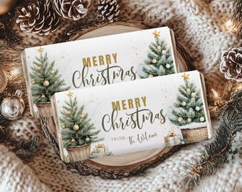 May include: Two rectangular Christmas-themed gift tags with the words "MERRY Christmas" in gold script. Each tag features a Christmas tree with gold star and ornaments, and a woven basket. The bottom tag reads "FROM The Welcome".