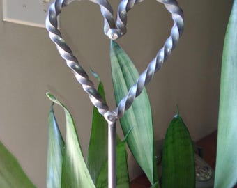 1 twisted heart raw steel flower stake pot and garden art