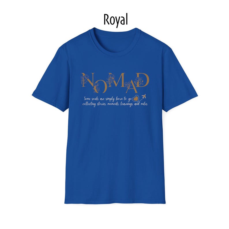 May include: Royal blue t-shirt with the word "NOMAD" in gold script. Below the word "NOMAD" is the phrase "Some souls are simply born to go collecting stories, moments, learnings and miles."