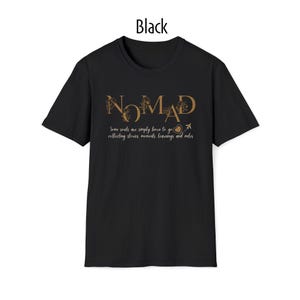 May include: Black crew neck t-shirt with the word "NOMAD" in a gold font. The shirt also features the text "Some souls are simply born to go collecting stories, moments, learnings and miles."