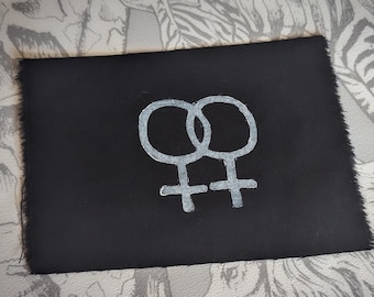Símbolo de Venus y lesbiana entrelazados: parche para coser