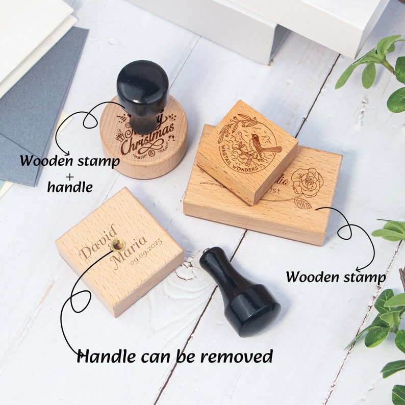 May include: Four wooden stamps with different designs. The stamps are square and have a handle that can be removed. The designs include a Christmas greeting, a bird with a floral design, a rose, and a personalised message with a date.