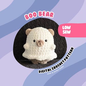 May include: A white crocheted Boo Bear plush toy with brown ears and nose. The toy is sitting on a black surface. The text "BOO BEAR" is written in pink letters above the toy. The text "LOW SEW" is written in pink letters on a pink background to the right of the toy. The text "DIGITAL CROCHET PATTERN" is written in white letters on a black background below the toy. The text "HOOK & HAVEN STUDIO" is written in white letters below the text "DIGITAL CROCHET PATTERN".