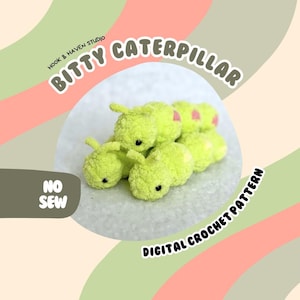 May include: A green crocheted caterpillar with pink accents. The caterpillar is made of yarn and has a no-sew design. The image includes the text "Bitty Caterpillar" and "Digital Crochet Pattern".