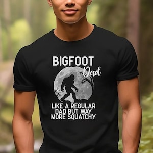 Bigfoot Dad, like a regular dad but way more squatchy short sleeved tee shirt. Perfect for Father’s Day!