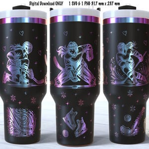 May include: A black stainless steel tumbler with a design of a female hockey player. The tumbler has a handle and is 13.5 inches tall and 4.5 inches wide. The design is in a rainbow iridescent color.