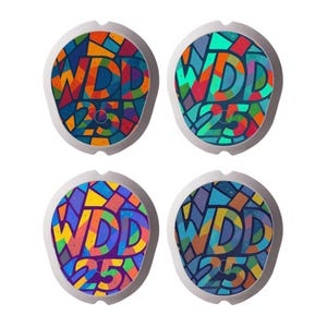 May include: Four circular adhesive patches with a white border, each featuring a colourful stained-glass mosaic pattern. The text WDD 25 is printed in the centre of each patch in a bold, dark font, surrounded by geometric shapes in various colours.