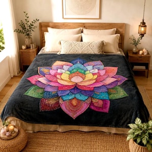 May include: A dark charcoal gray fleece blanket featuring a large, vibrant, multi-colored lotus flower design in the center. The petals display a spectrum of pink, yellow, blue, green, and purple hues with intricate, detailed patterns throughout.