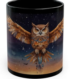 May include: Black coffee mug with a colorful owl illustration. The owl is flying with its wings spread wide. The background is a dark blue with stars and a sunset.