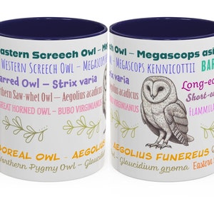 May include: White ceramic mug with a navy blue interior and handle. The mug features a detailed illustration of an owl and various owl species names in different colors. Decorative green and gold leaf sprigs are also included.