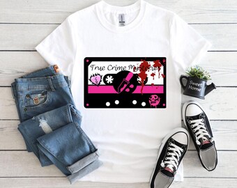 May include: White t-shirt with a black and pink cassette tape graphic. The tape has the text "True Crime Mysteries" and a bloody knife.