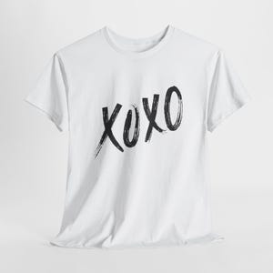 a white t - shirt with the word oxx printed on it
