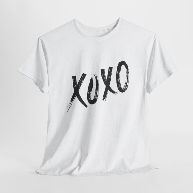 a white t - shirt with the word oxx printed on it