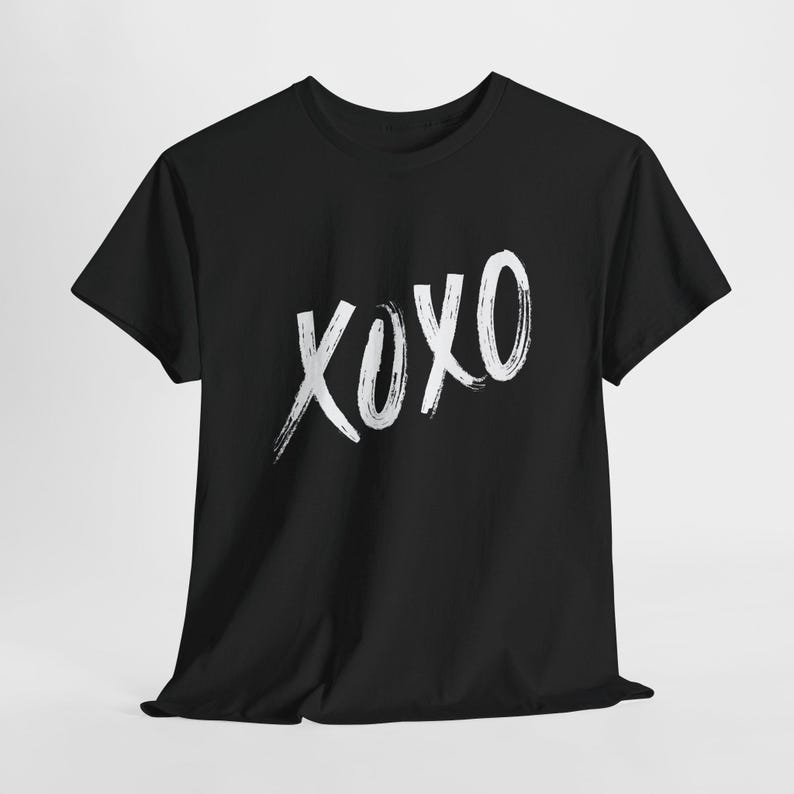 a black t - shirt with the word xoxo printed on it