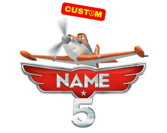 May include: A red and silver airplane wing with the word "NAME" in silver letters and the number "5" in silver. The airplane is orange and white with a blue propeller. The words "CUSTOM" are in yellow letters on a red rectangle.