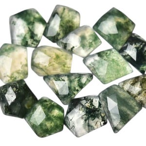 May include: A collection of faceted moss agate gemstones. The stones display a mix of translucent white, cream, and green hues, with intricate patterns resembling moss. The gemstones are cut into various geometric shapes, showcasing their natural beauty.
