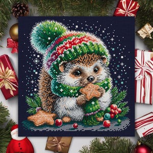 May include: A cute hedgehog wearing a green and red winter hat and scarf, holding a gingerbread cookie. The hedgehog is surrounded by red berries, pine branches, and snowflakes on a dark blue background.